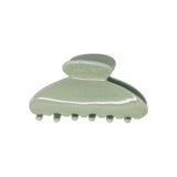 Classic claw clip in Soft Sage, a glossy sage green hair claw clip, on a white background.