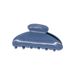 Classic claw clip in Storm Blue, a glossy deep blue hair claw clip, on a white background.