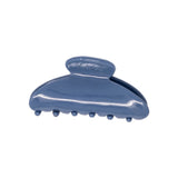 Classic claw clip in Storm Blue, a glossy deep blue hair claw clip, on a white background.