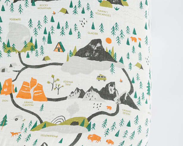 Close-up of the illustrated national parks map print on the Clementine Kids National Parks Crib Sheet