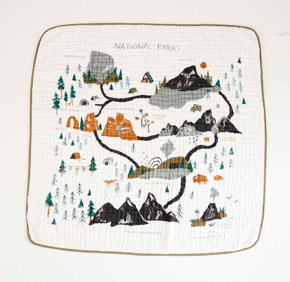 Clementine Kids Reversible National Parks Quilt laid flat showing the illustrated parks map