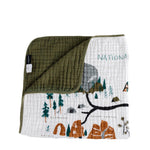 Clementine Kids Reversible National Parks Quilt with an illustrated parks map and an olive green reverse