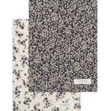 Colored Organics 2-Pack Organic Baby Burp Cloths in Poppy and Chicory Floral, one cream floral cloth and one navy cloth with a dense white floral print