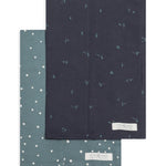 Colored Organics 2-Pack Organic Baby Burp Cloths in Square Dot and Cactus Navy, one sage green polka dot cloth and one navy cloth with a small cactus print