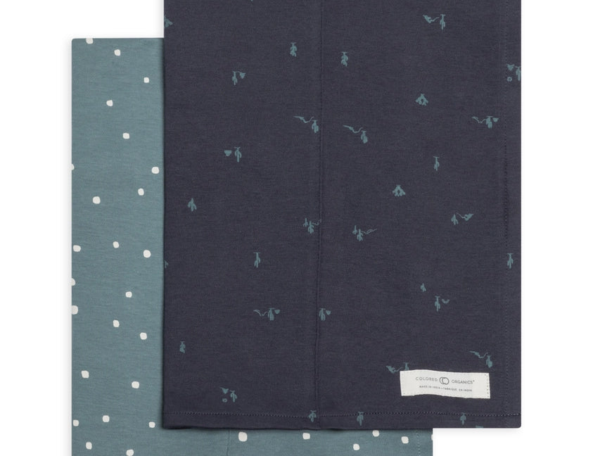 Colored Organics 2-Pack Organic Baby Burp Cloths in Square Dot and Cactus Navy, one sage green polka dot cloth and one navy cloth with a small cactus print