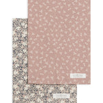 Colored Organics 2-Pack Organic Baby Burp Cloths in Verbena and Wild Floral, one cream floral cloth and one dusty rose cloth with a small white sprig print