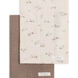 Colored Organics 2-Pack Organic Baby Muslin Burp Cloth in Desert and Taupe, one solid taupe cloth and one ivory cloth with a tiny desert cactus print