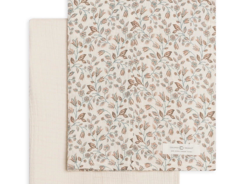 Colored Organics 2-Pack Organic Baby Muslin Burp Cloth in Yuma Floral and Ivory, one ivory cloth and one cloth with a rust and sage leaf print