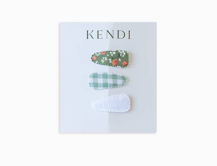Colored Organics Mini Baby Hair Clips 3-Pack on a Kendi card: strawberry print, green gingham and white eyelet