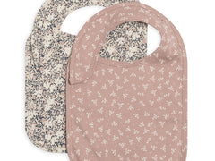 Colored Organics Organic 2-Pack Bibs in Verbena and Wild Floral, a cream floral bib and a mauve floral bib