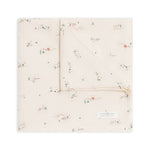 Colored Organics Organic Baby Muslin Swaddle Blanket in Desert, a cream swaddle with a tiny desert scene print, folded