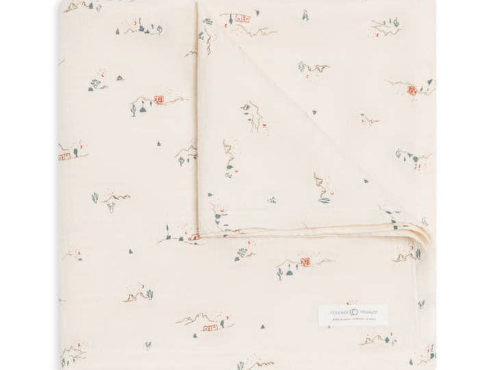 Colored Organics Organic Baby Muslin Swaddle Blanket in Desert, a cream swaddle with a tiny desert scene print, folded