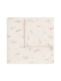 Colored Organics Organic Baby Muslin Swaddle Blanket in Desert, a cream swaddle with a tiny desert scene print, folded