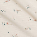 Close-up of the tiny cactus and mountain print on the Colored Organics Organic Muslin Swaddle Blanket in Desert