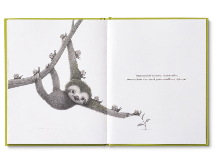 Compendium Being Kind book open to a page of a sloth hanging from a branch holding a flower