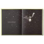 Compendium Being Kind book open to a sloth reaching for a star in a black night sky