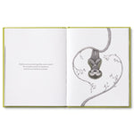 Compendium Being Kind book open to two sloths hanging from vines in a heart shape