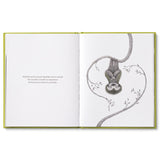 Compendium Being Kind book open to two sloths hanging from vines in a heart shape
