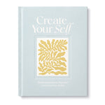 Compendium Create Your Self Guided Journal, a light blue cover with a yellow leaf illustration
