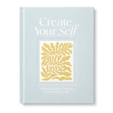 Compendium Create Your Self Guided Journal, a light blue cover with a yellow leaf illustration
