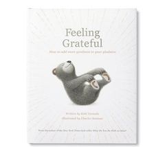 Compendium Feeling Grateful book cover with a gray bear lying on its back on a white sunburst background