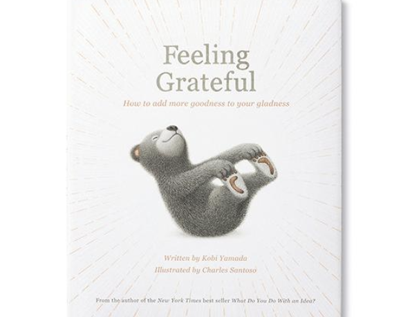 Compendium Feeling Grateful book cover with a gray bear lying on its back on a white sunburst background