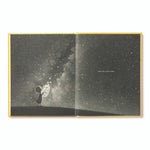 Compendium Finding Muchness book open to a bird gazing at a starry night sky