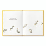Compendium Finding Muchness book open to a bird tumbling and playing across two pages