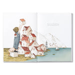 Compendium Maybe Deluxe Book open to a child building a stack of tiny houses