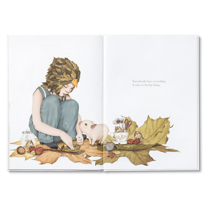 Compendium Maybe Deluxe Book open to a child and a piglet among autumn leaves
