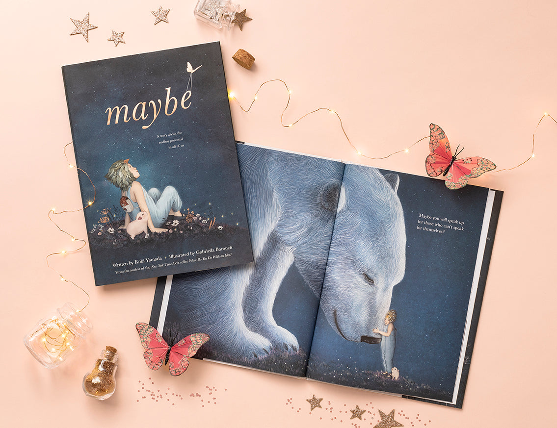 Compendium Maybe Deluxe Book open beside a closed copy with fairy lights, stars and butterflies