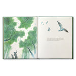 Compendium Noticing book open to a watercolor of birds flying over treetops