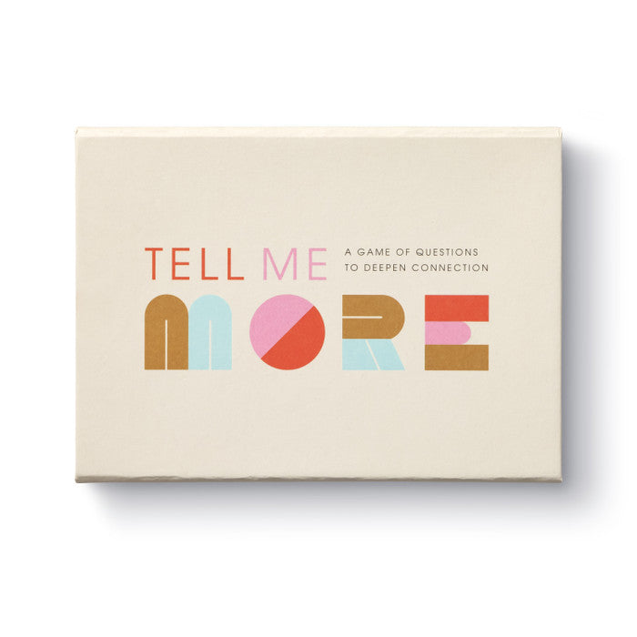 Compendium Tell Me More Game, a cream box with colorful lettering, a game of questions to deepen connection