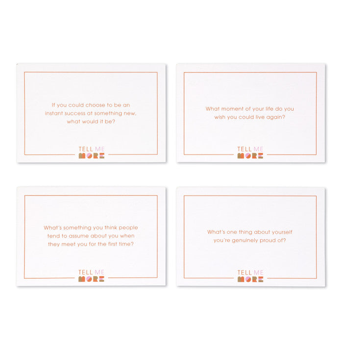 Four Compendium Tell Me More Game question cards laid out on white