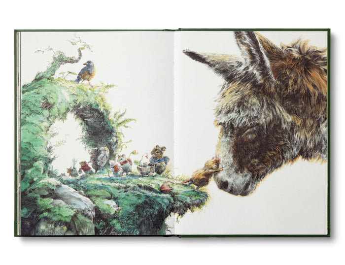 Compendium The Storyteller's Almanac open to a watercolor of a donkey meeting tiny characters on a mossy hill