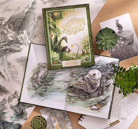 Compendium The Storyteller's Almanac book displayed with open pages, a succulent and pencils