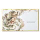 Compendium What Do You Do With a Chance book open to a child crouching in the grass near a golden bird