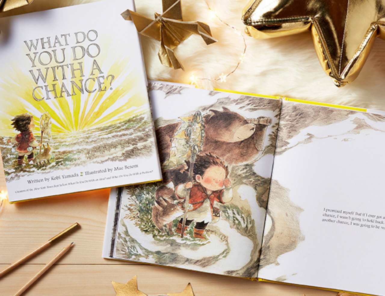 Compendium What Do You Do With a Chance book with an open copy, gold stars and pencils