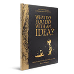 What Do You Do With an Idea? 10th Anniversary Edition by Compendium, black hardcover with gold foil cover and gold-edged pages, angled view on white