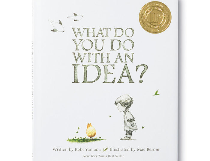 Compendium What Do You Do With an Idea book cover, a child looking at a small golden egg with a crown, New York Times bestseller