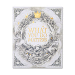 Compendium What You Do Matters Set slipcase, front view with a gold wreath and crown