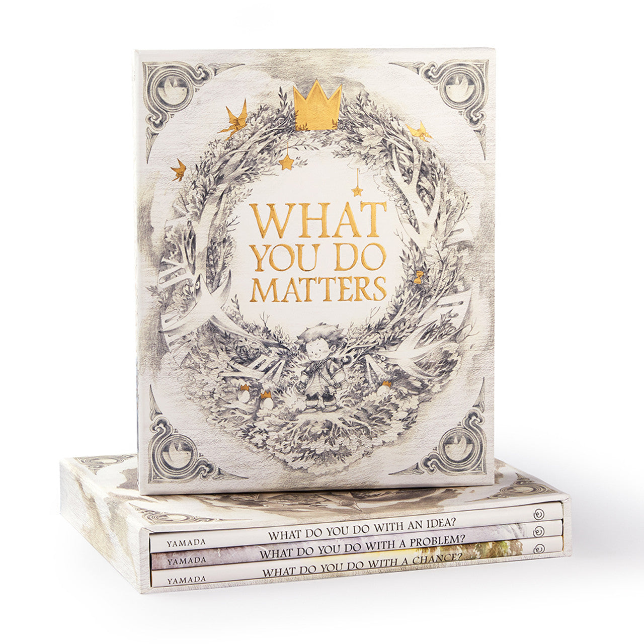 Compendium What You Do Matters boxed set, a cream slipcase with a gold wreath standing on the three books