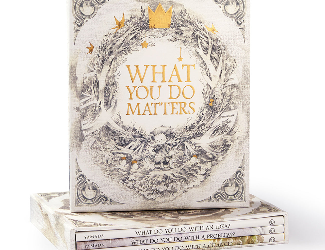 Compendium What You Do Matters boxed set, a cream slipcase with a gold wreath standing on the three books