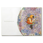 Compendium Why Not book open to a child sitting in a circle of colorful flowers
