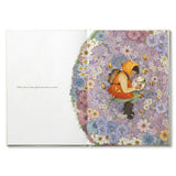 Compendium Why Not book open to a child sitting in a circle of colorful flowers