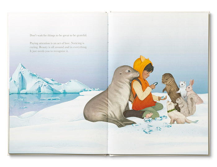 Compendium Why Not book open to a child with a walrus and animals on an ice floe