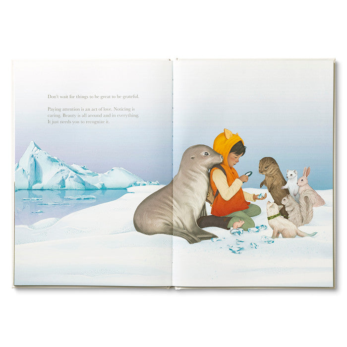 Compendium Why Not book open to a child with a walrus and animals on an ice floe