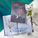 Compendium Why Not book on an aurora backdrop with a plush arctic fox and an open copy