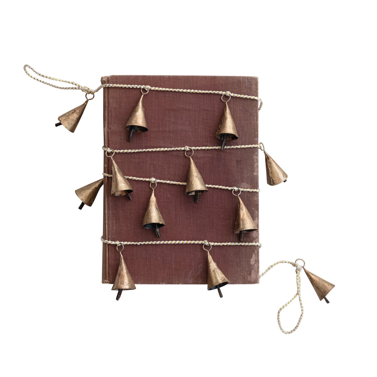 Metal bell garland in a gold finish on a white and gold cord