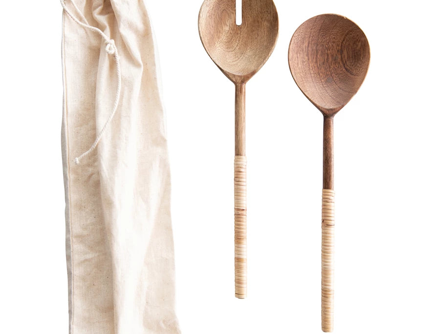 Creative Co-Op Salad Servers with Wrapped Handles, two wooden servers with rattan-wrapped handles and a linen bag